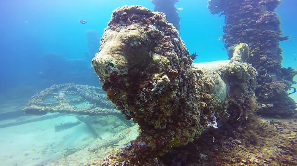 scary underwater statues