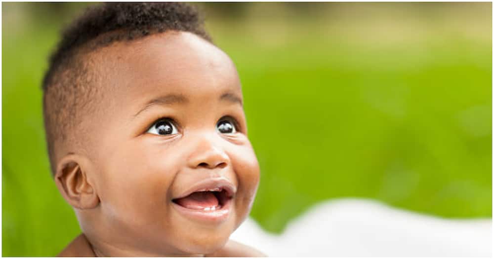 Black baby smiling. Photo for illustration.