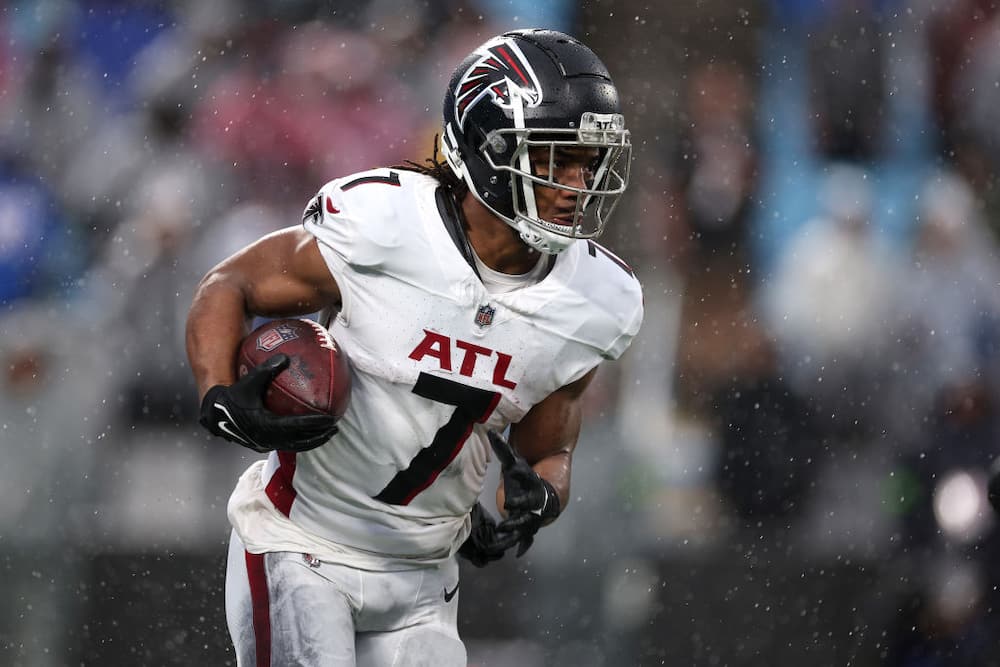 Bijan Robinson #7 of the Atlanta Falcons carries the ball during the second half of the game against the Carolina Panthers at Bank of America Stadium on December 17, 2023 in Charlotte, North Carolina.