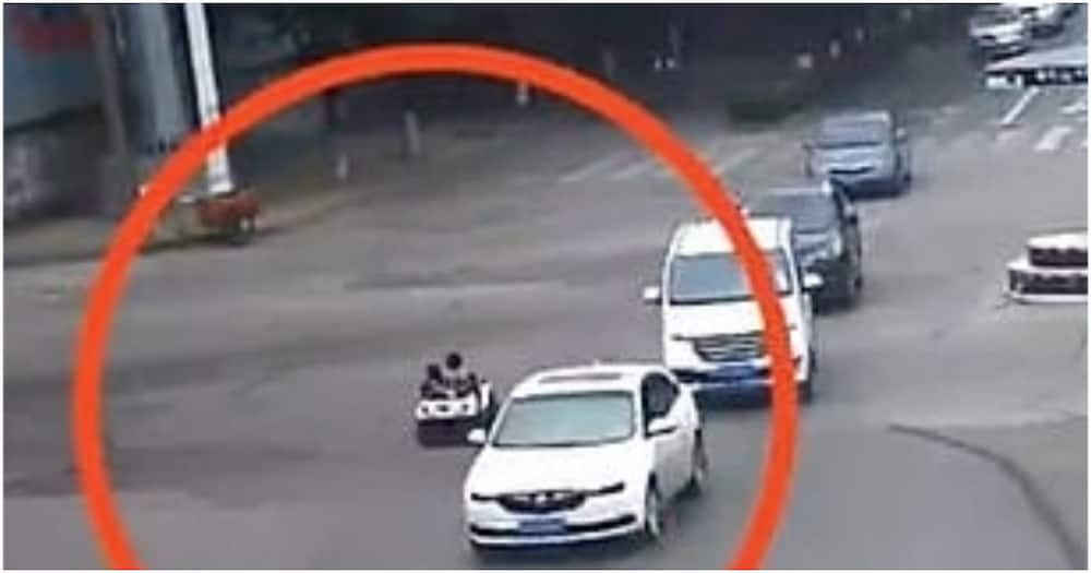 Boy caught on busy highway taking little girl for a ride in toy car