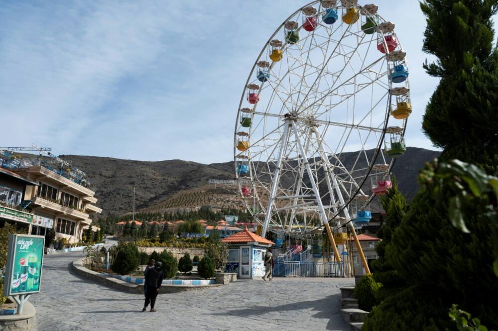 Taliban guards stand in the Habibullah Zazai Park on the outskirts of Kabul