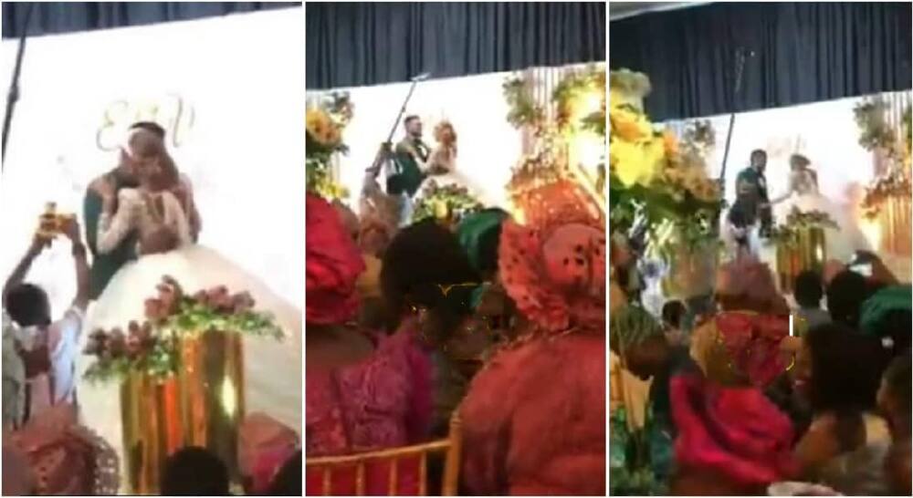 Nigerian mum stops bride from kissing groom for too long at a wedding reception.