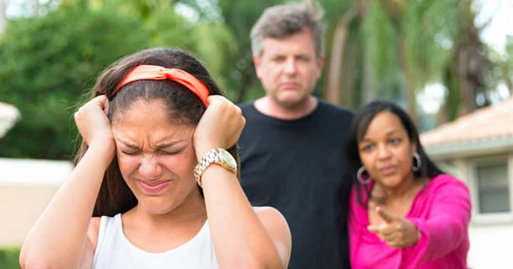 Lady blocking her ears, frustrated. Photo for illustration.