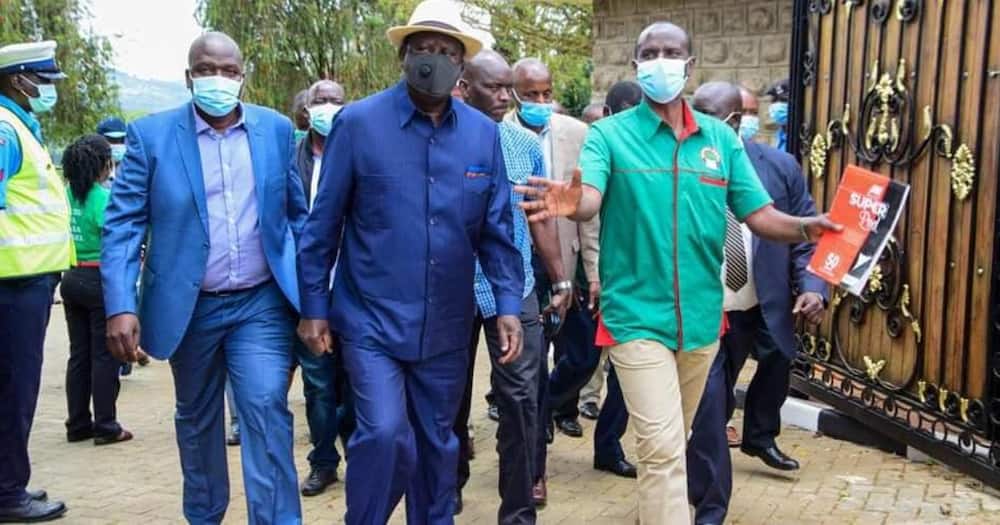 Wilson Sossion (green) welcoming ODM leader Raila Odinga to his home in 2020. Photo: Raila Odinga.