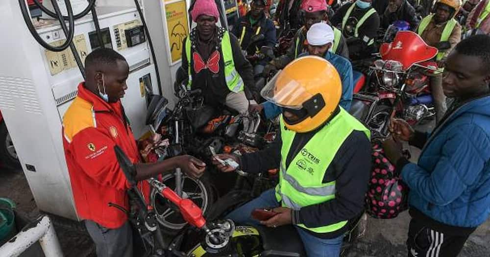 The boda boda operator converted his motorcycle to using cooking gas.
