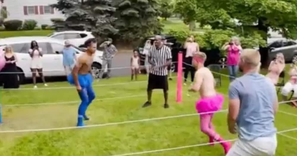 A dad organised a wrestling match with his two brothers to reveal his baby's gender. Photo:943thepoint.com.