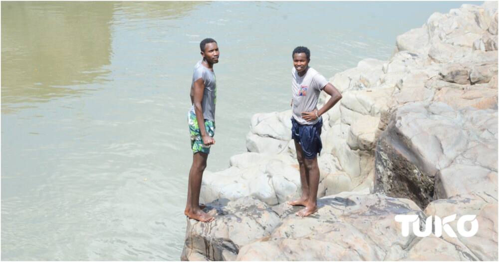 Daring youths making a living using skillful dives that scare crocodiles away