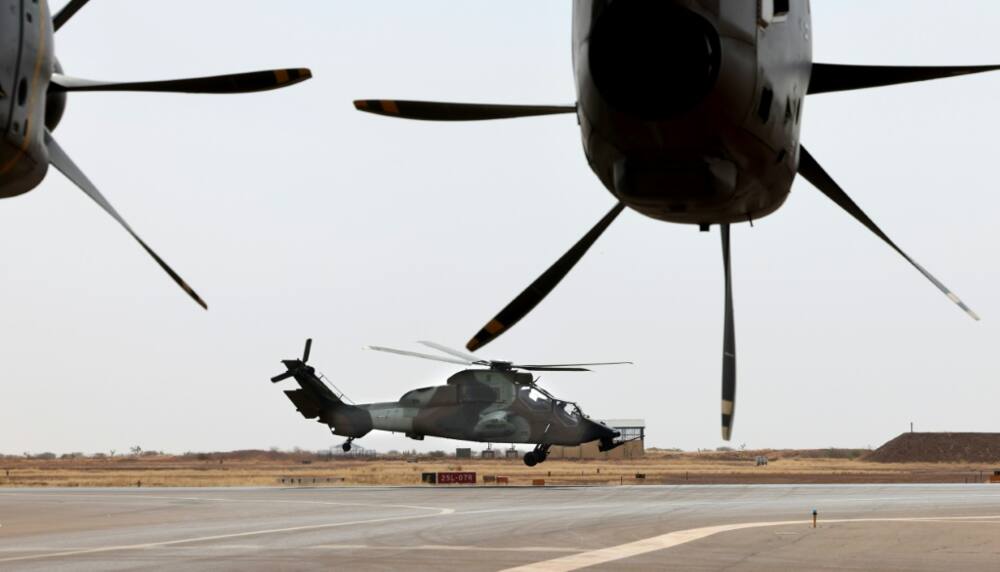 Airpower: A French military transport plane and combat helicopter at Gao in December 2021. France announced on Monday that it had vacated the base, its last in Mali