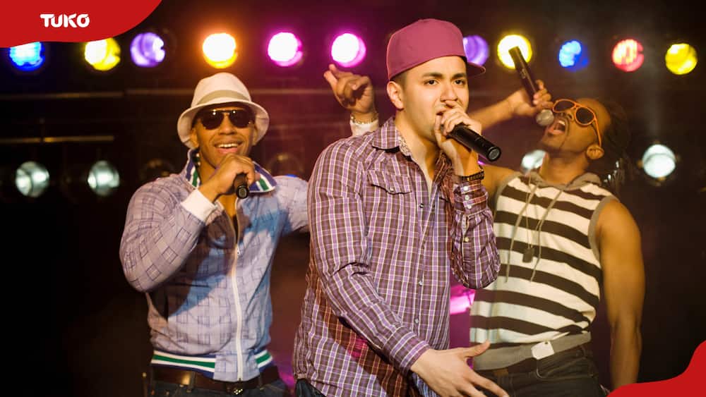 Hip hop musical group performing onstage.