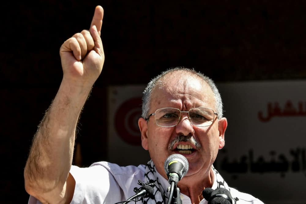 The head of Tunisia's UGTT trade union confederation addresses supporters on June 16, the first day of a nationwide strike opposing the government's proposals for IMF-backed reforms