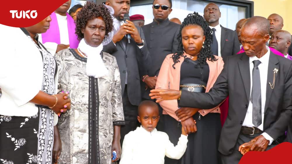 Kelvin Kiptum's father, Samson Cheruiyot, mother, Mary Kangogo, wife, Asenath Rotich, and daughter, Precious, during the burial service of the athlete.