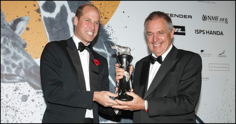 Ian Craig receiving a trophy from Prince William in London