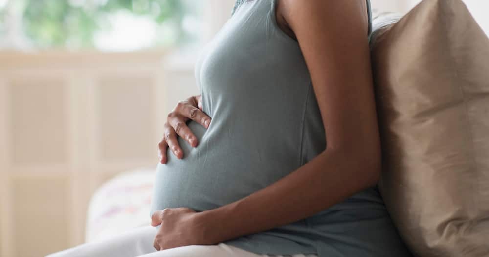 Photo illustration of a pregnant woman.