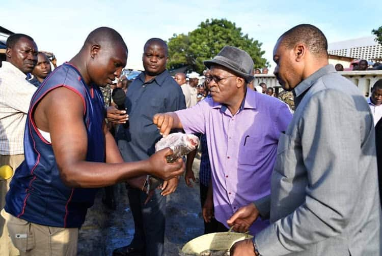 Tanzania's President John Magufuli goes shopping with basket in support of plastic bag ban