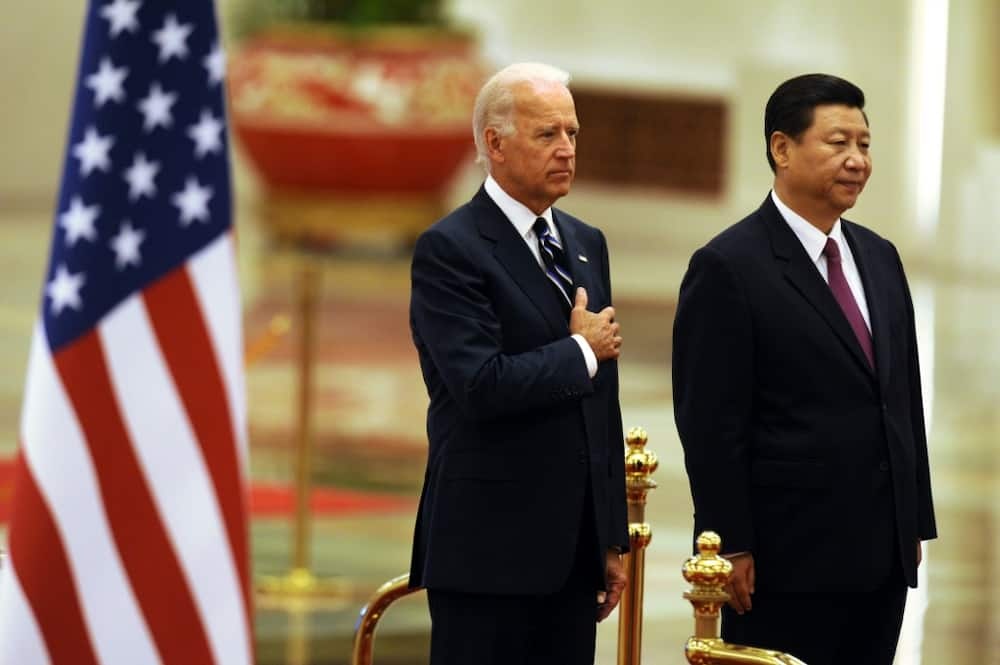 Traders are keenly awaiting a meeting between Joe Biden (L) and Xi Jinping in Bali later in the day