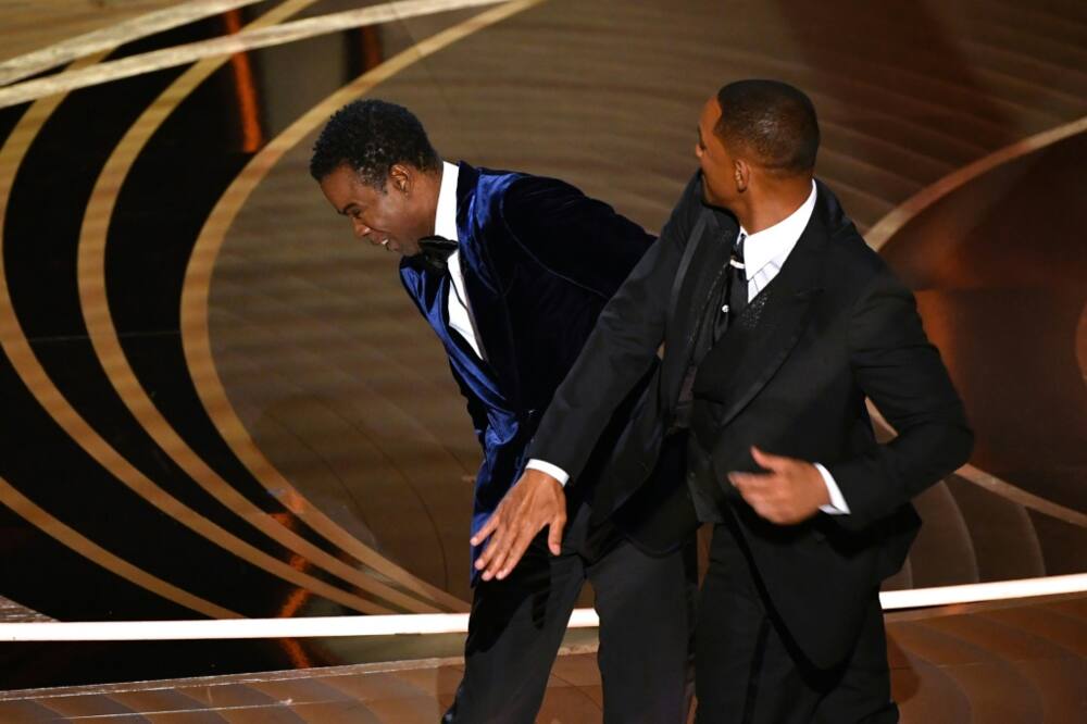 Will Smith marched onto stage during the Oscars ceremony broadcast live around the world and hit the comedian Chris Rock, over a joke about the star's wife