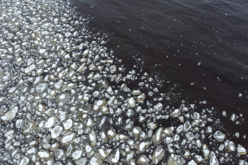 A photo taken in Finland on May 3, 2023, shows ice chunks drifting in the Bothnia Gulf near the shore at the beginning of the spring