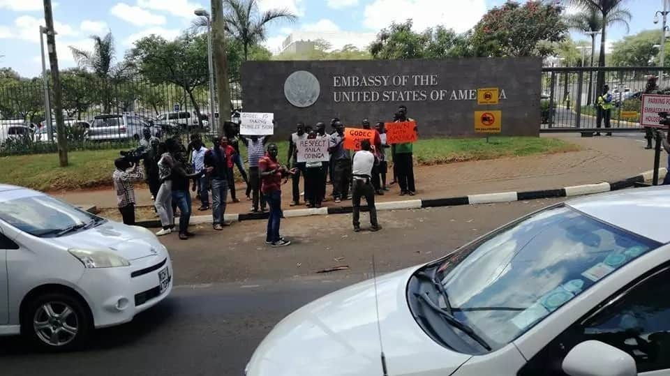 Angry NASA supporters burn American flags outside the embassy in Gigiri