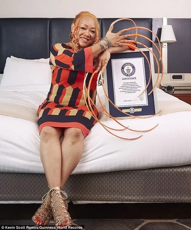 She shows off her Guinness World Records certificate. Photo: Guinness World Records