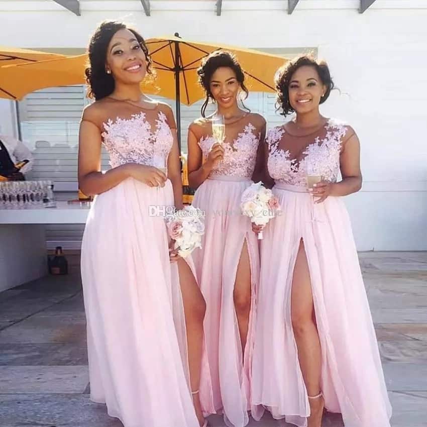 Beautiful bridesmaids in flowing, pink, chiffon dress