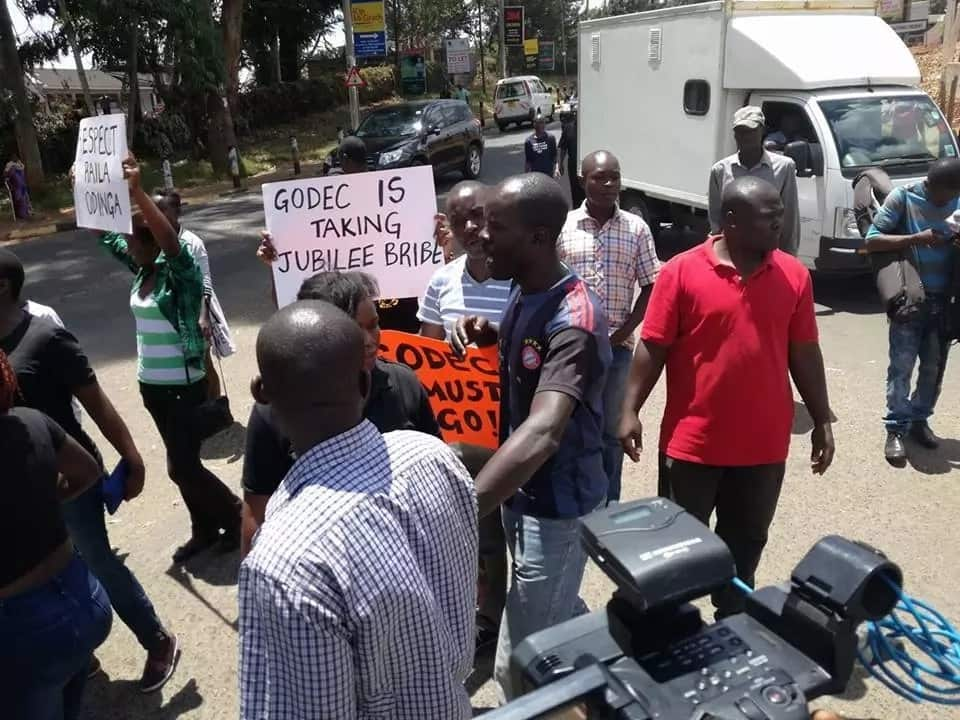 Angry NASA supporters burn American flags outside the embassy in Gigiri