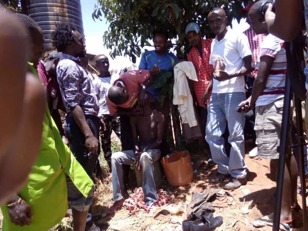 Stinking Murang'a taxi driver forcibly washed in public by colleagues