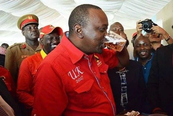 Uhuru excites social media after drowning a glass of beer before cameras in Kisumu (Photo)