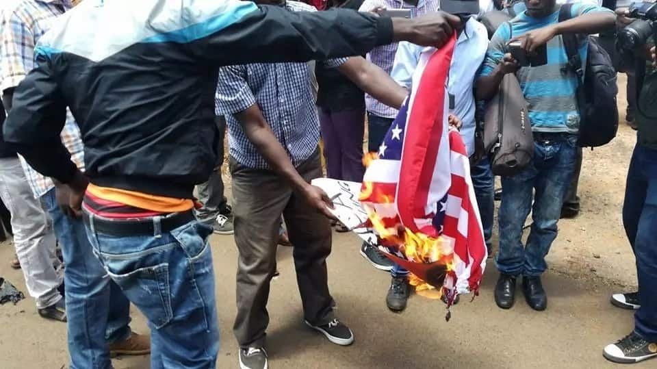 Angry NASA supporters burn American flags outside the embassy in Gigiri