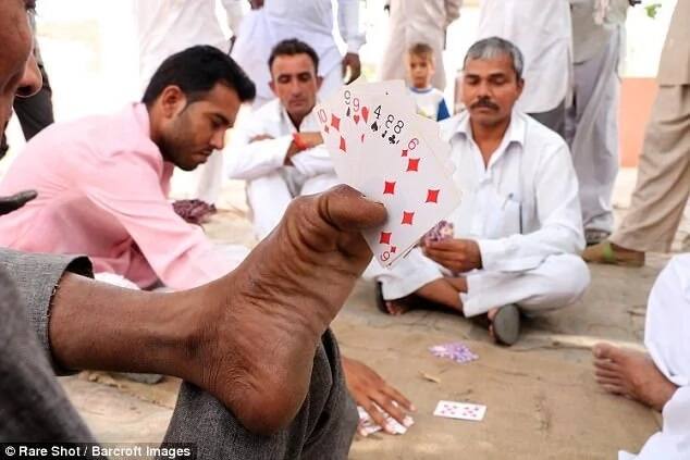 He also likes to play cards in his spare time. Photo: Barcroft Images