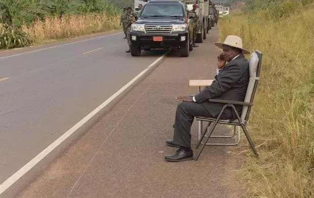 Museveni pulls another challenge, plays soccer in the middle of the road (Photos)