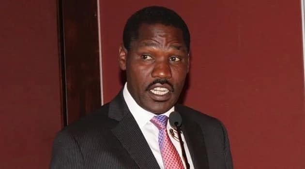 Governor Munya 'finishes' his juice before Larry Madowo and other guests start