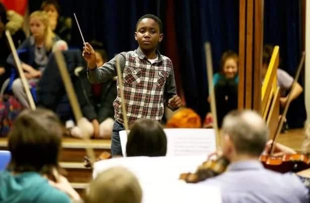 Child prodigy, 11, set to break world record of YOUNGEST orchestra conductor (photos, video)
