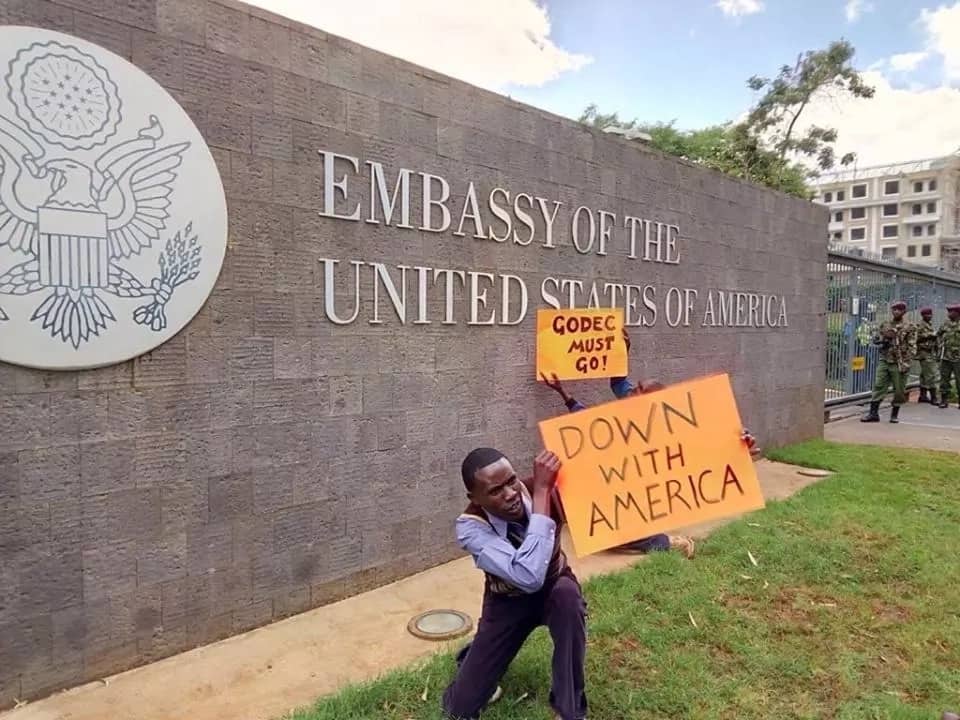 Angry NASA supporters burn American flags outside the embassy in Gigiri