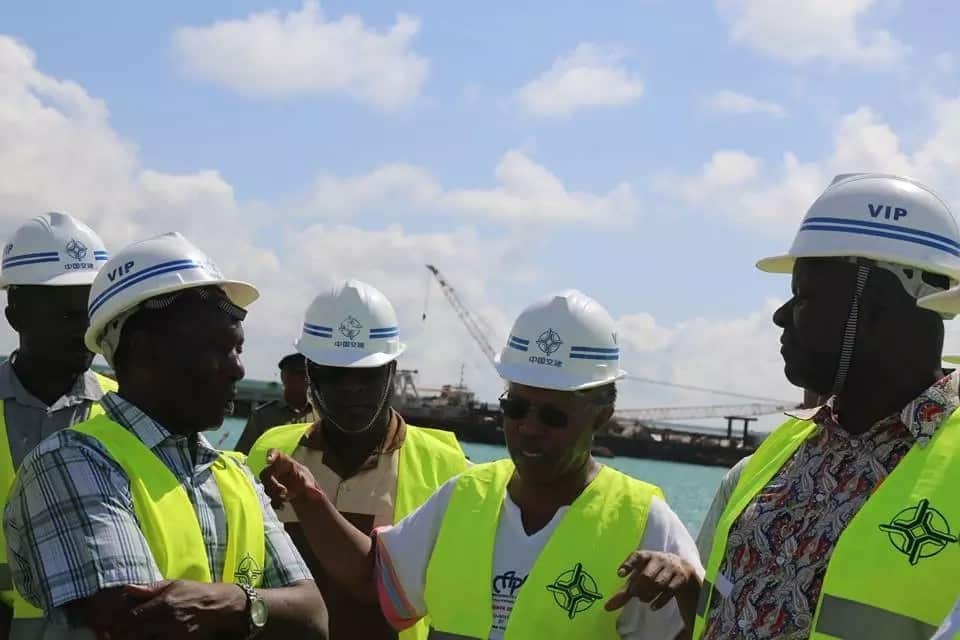 Transport PS Professor Paul Maringa Mwangi (bespectacled) engages with Treasury head of Budget Ontwake Ondari (Left) and LAPSSET Director General Silvester Kasuku (Right) in a previous visit in Lamu over the project's status.