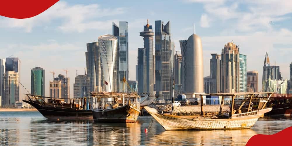 A picture of the Doha skyline and fishing boats in Qatar.