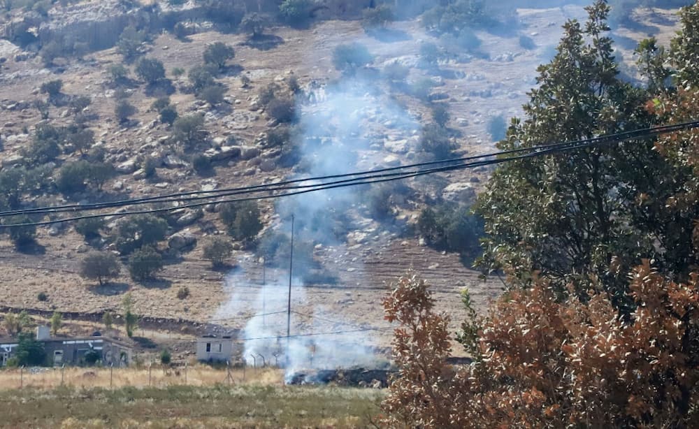 Smoke billows on the horizon in the village of Zrgoiz on Wednesday