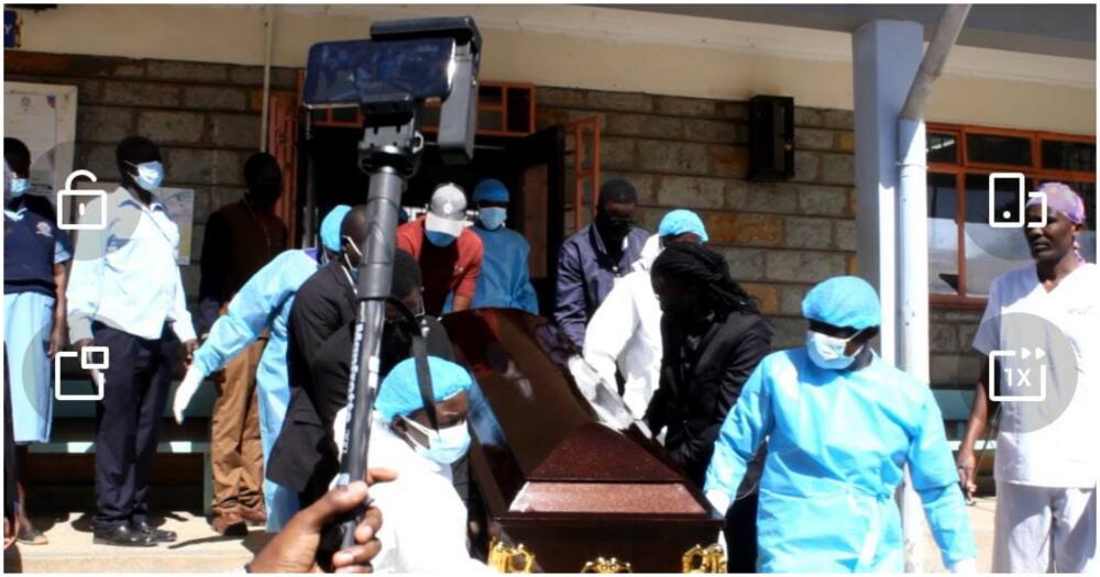 His family was helped by the mortuary attendants to carry his casket. Photo: Vincent Mboya.