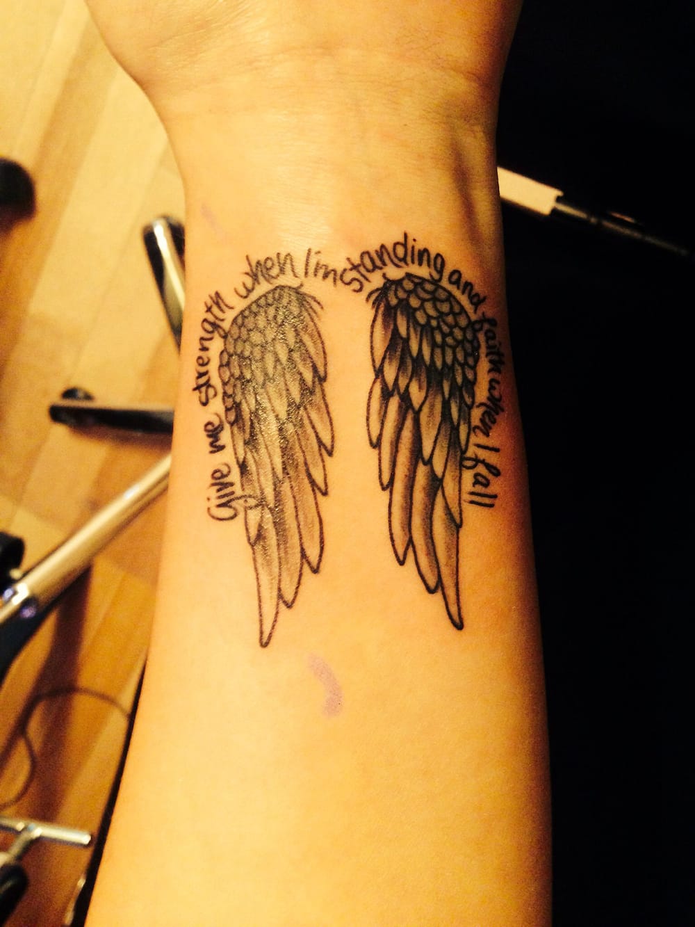 simple wing tattoo designs for girls on back