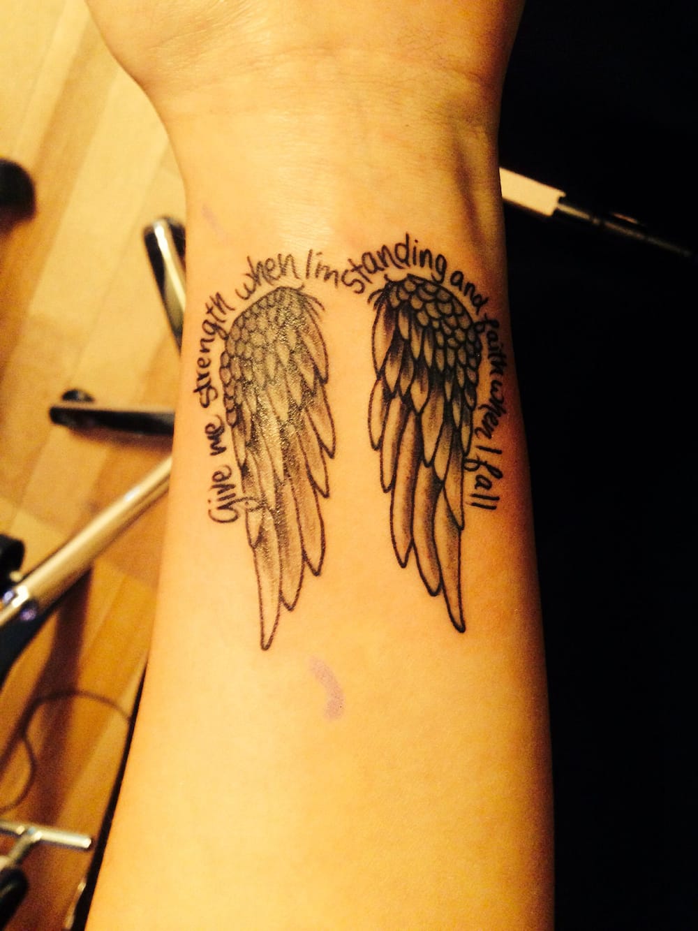 name tattoos with wings