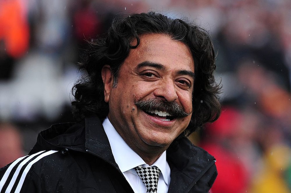 Fulham's Pakistani-born US owner Shahid Khan smiles before the English Premier League football match between Fulham and Arsenal at Craven Cottage in London.
