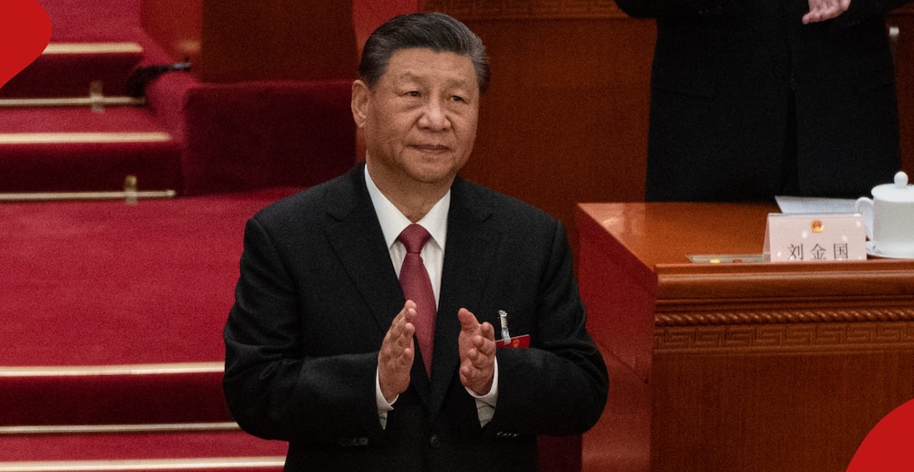 China's President Xi Jinping gestures at a meeting.