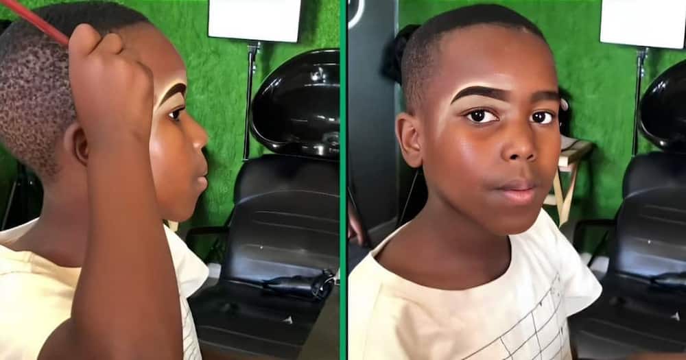 A TikTok video shows a little boy applying makeup on his face.