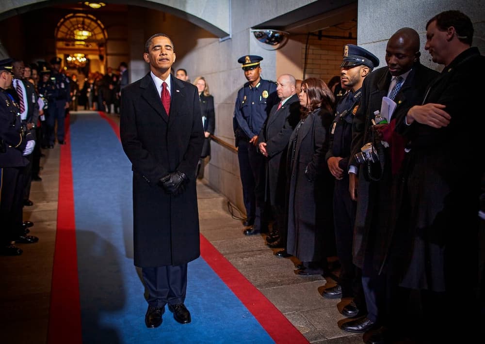 Obama waits to walk out as the 44th President of the United States in 2009