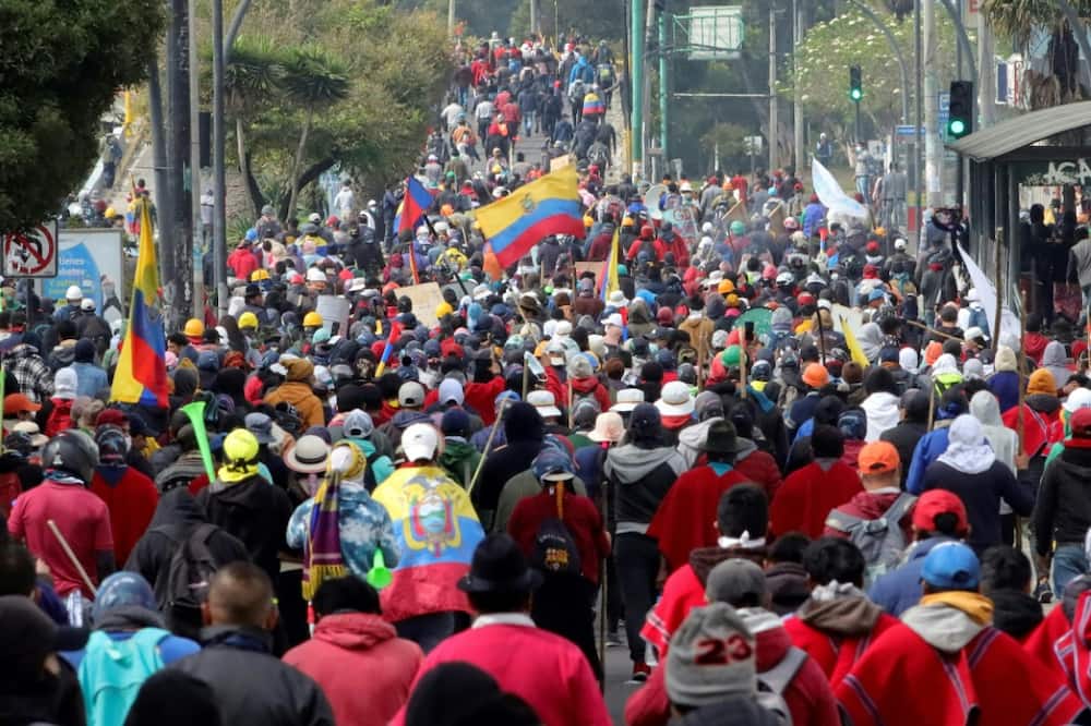 Indigenous people march towards the Central University of Ecuador (UCE) in Quito, on June 22, 2022, on the tenth consecutive day of indigenous-led protests against the Ecuadoran government