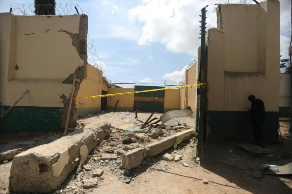 Police cordoned off a section of the prison that was destroyed in the attack