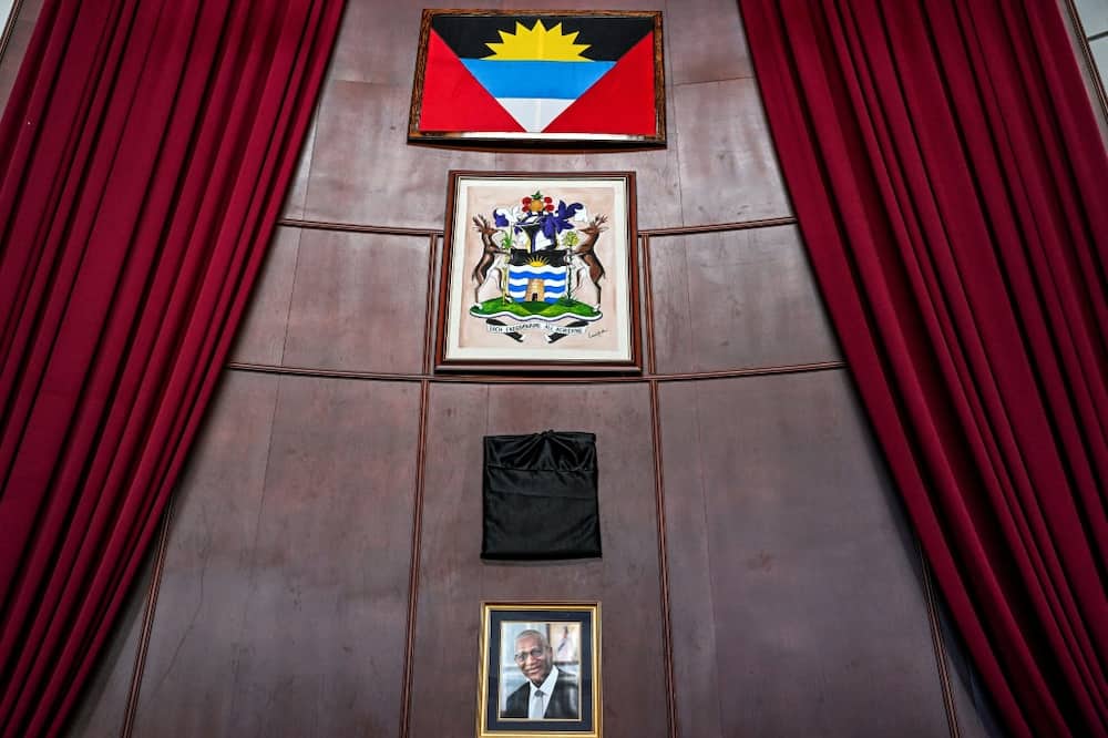 After the death of Queen Elizabeth II, the Antiguan parliament ceremonially covered her portrait in black cloth