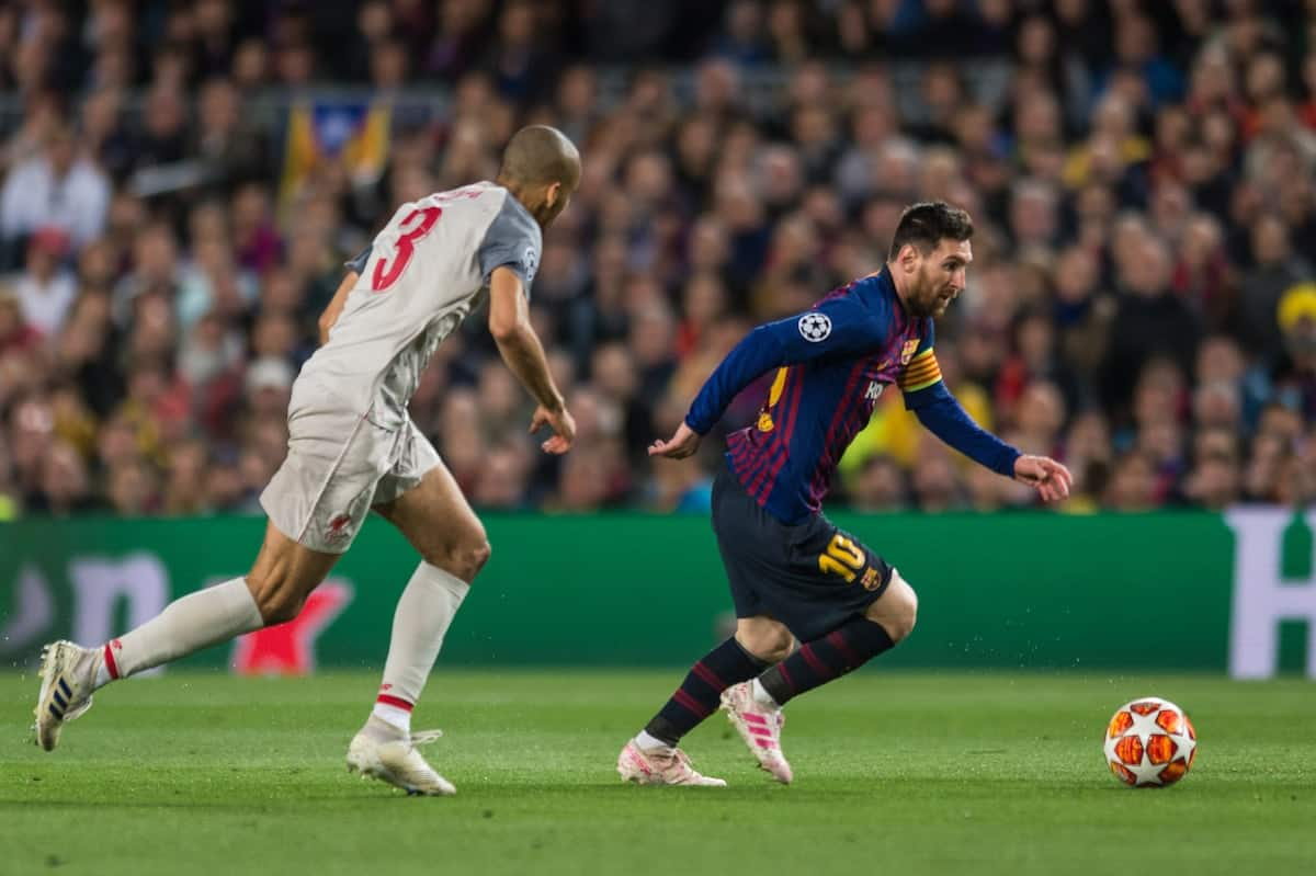 Lionel Messi appears to hit Fabinho's head in Barcelona's win over ...