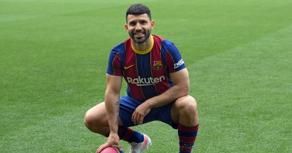 Sergio Aguero poses on the pitch of the Camp Nou stadium in Barcelona during his official presentation as a new player of FC Barcelona on May 31, 2021. Photo by LLUIS GENE/AFP via Getty Images.