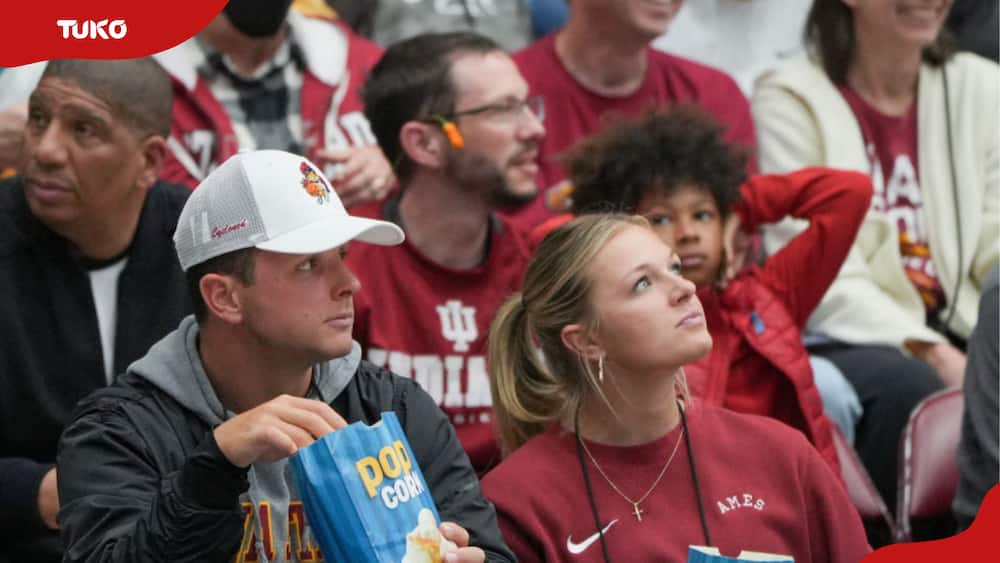 Jenna Brandt (L) and her husband Brock Purdy watching game action