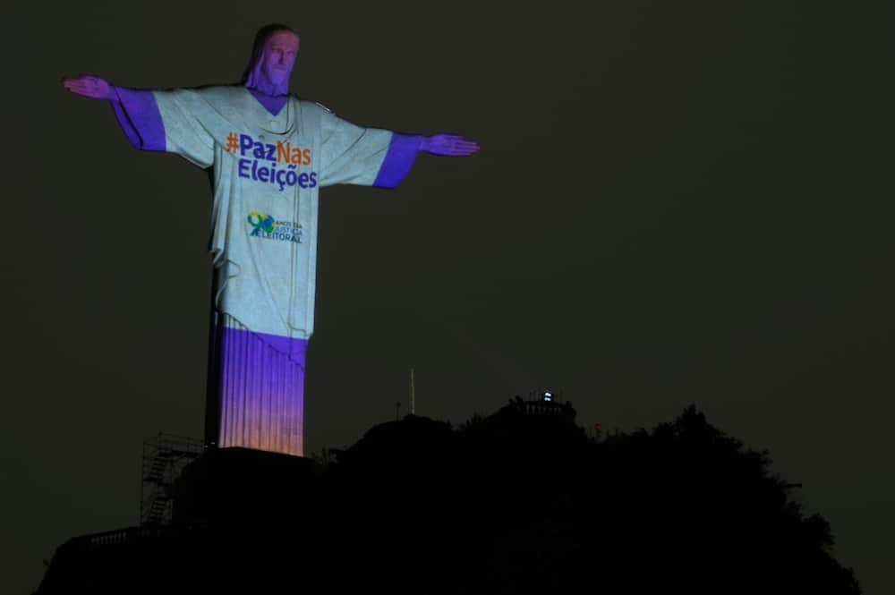 The Christ the Redeemer statue is illuminated with the message "Peace in the Elections" in Rio de Janeiro on October 1, 2022